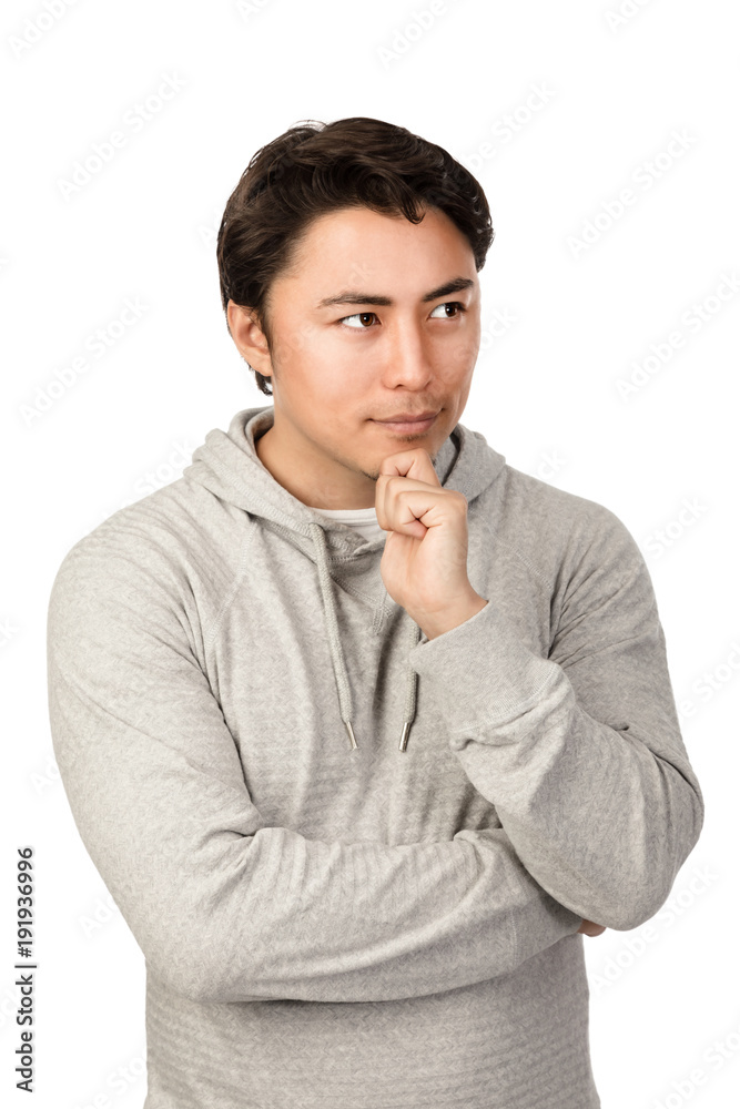 Confused man wearing a grey hoodie thinking. Standing against a white background. Confused man wearing a grey hoodie thinking. Standing against a white background.