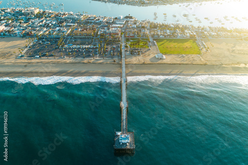 Aerial view of Balboa Pier in Newport Beach Beach, California at sunrise