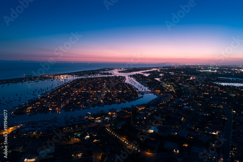 Aerial view of Balboa Island in Newport Beach at twilight © Newport Coast Media