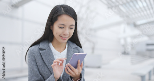 Young Businesswoman using cellphone at outdoor