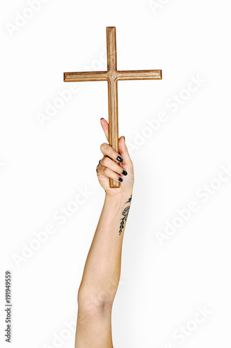 Hand holding cross