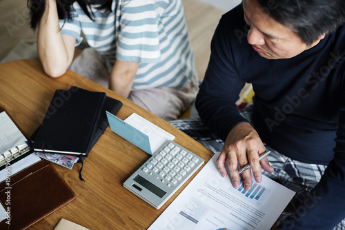 Asian couple planning for the investment