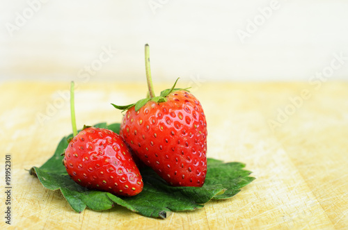 Two Strawberry macro close up for red fruits concept