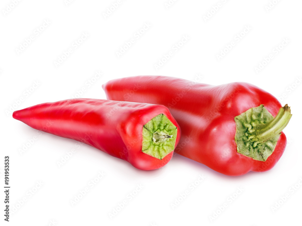 Two red peppers with green tail isolated on white background. Retouched peppers with texture, glare and shadow. Close-up view, objects turned to the right.