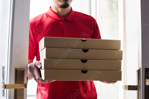Man delivery pizza to customer photo