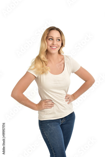 3/4 portrait of blonde girl wearing white shirt, happy expression. isolated on white background.