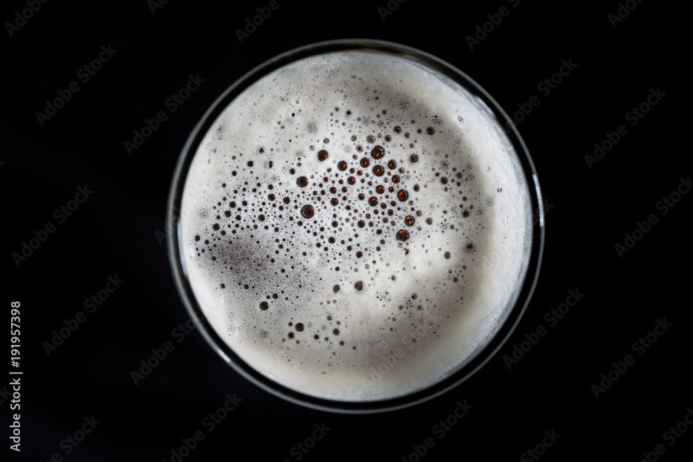 Top view glass of beer, beer foam and bubbles texture Top view glass of beer, beer foam and bubbles texture