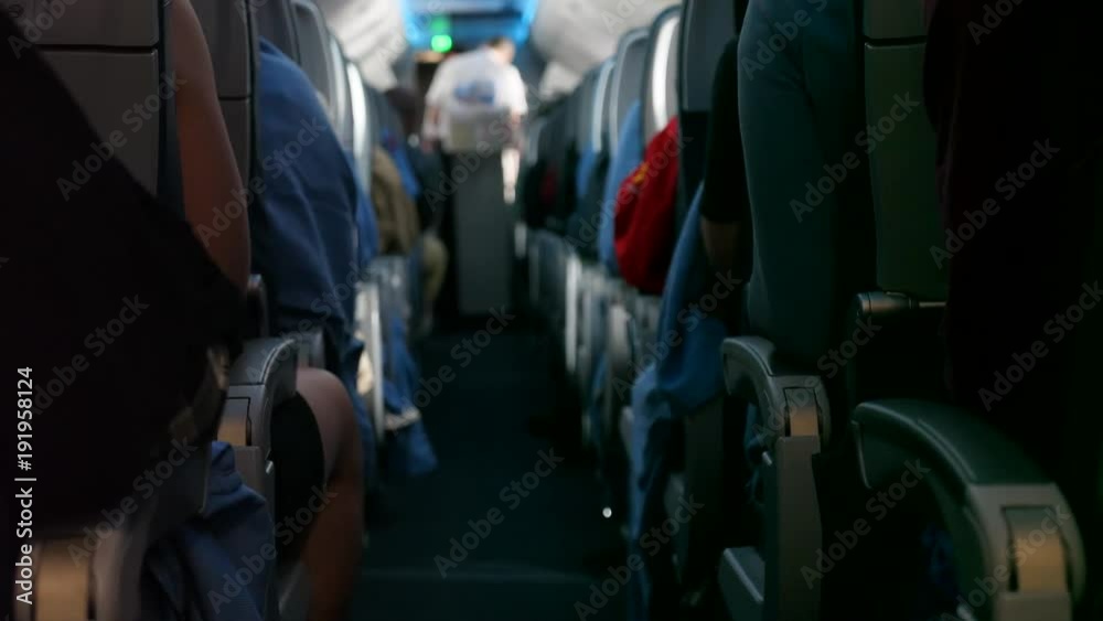 Passengers ride on bumpy commercial airline in their seats Passengers ride on bumpy commercial airline in their seats