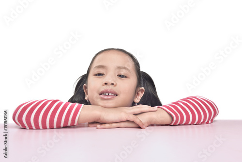 Portrait of asian little girl lean on the table