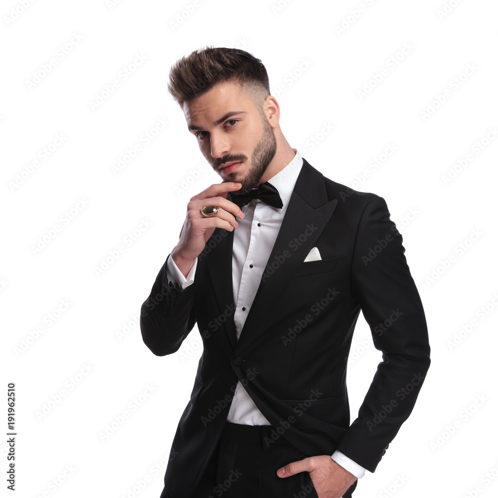 portrait of a pensive man in tuxedo wearing golden ring portrait of a pensive man in tuxedo wearing golden ring