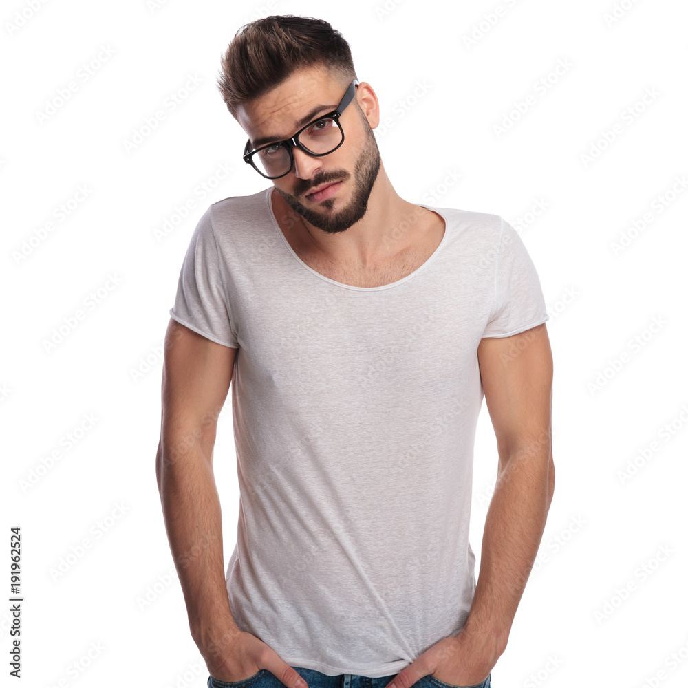 shy young casual man wearing glasses shy young casual man wearing glasses