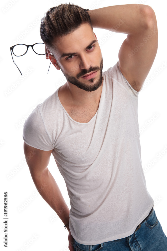 sexy casual man holding glasses in hand and behind head Stock Photo | Adobe  Stock