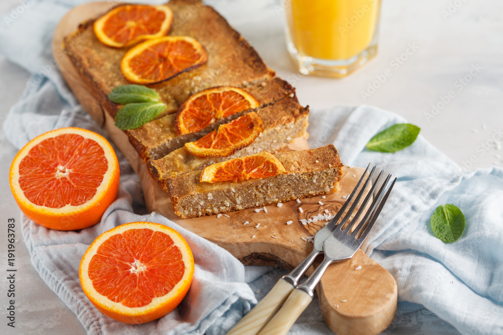 Healthy homemade vegan orange cake with coconut, copy space. Healthy vegan food concept. Healthy homemade vegan orange cake with coconut, copy space. Healthy vegan food concept.