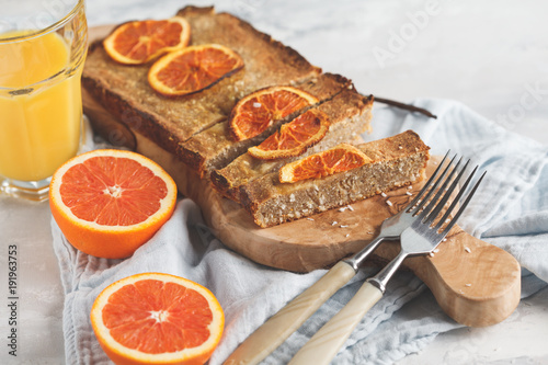 Healthy homemade vegan orange cake with coconut, copy space. Healthy vegan food concept.
