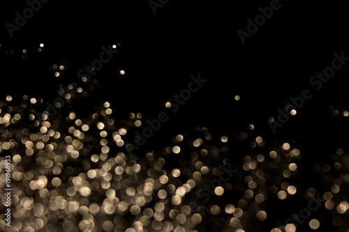 красивый фон с блестками и боке на черном фоне        