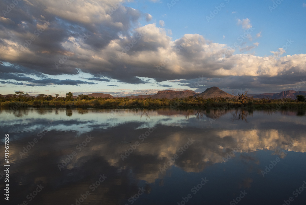 Cloud reflections in Marataba River at sunset, Limpopo, South Africa Cloud reflections in Marataba River at sunset, Limpopo, South Africa