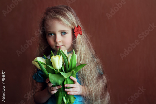 beautiful girl with tulips flowers in celebration of international women's day