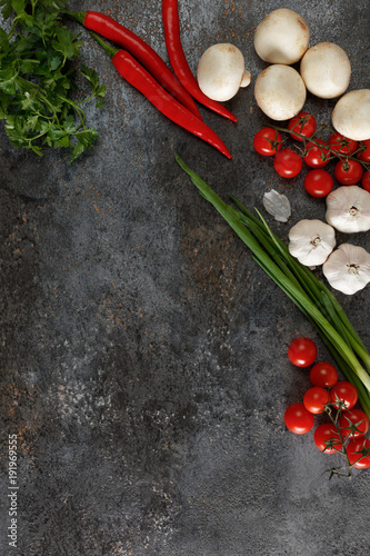 Fototapeta Naklejka Na Ścianę i Meble -  Fresh juicy vegetables with copy space on black background, top view.