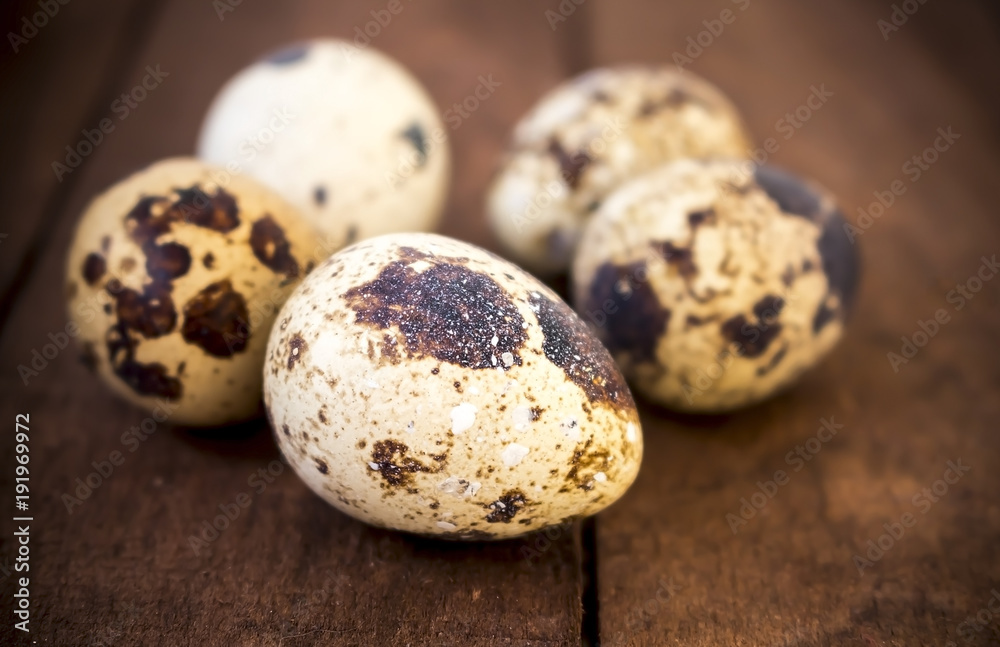 Quail eggs on a wooden table Quail eggs on a wooden table