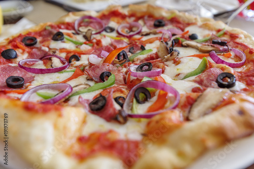 Italian style thin pizza on the table