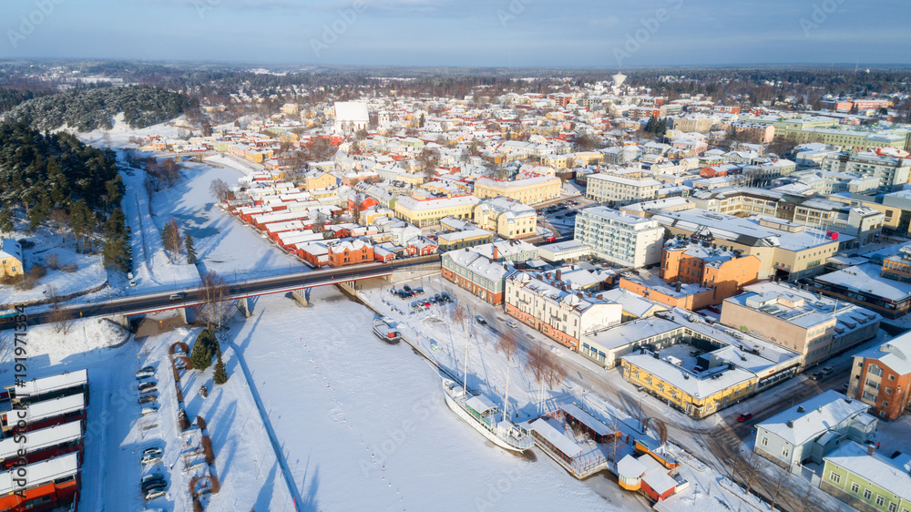 Beautiful view of wooden red house and Porvoo old town near the river.