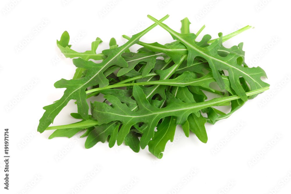 Heap of Green fresh rucola or arugula leaf isolated on white background Heap of Green fresh rucola or arugula leaf isolated on white background