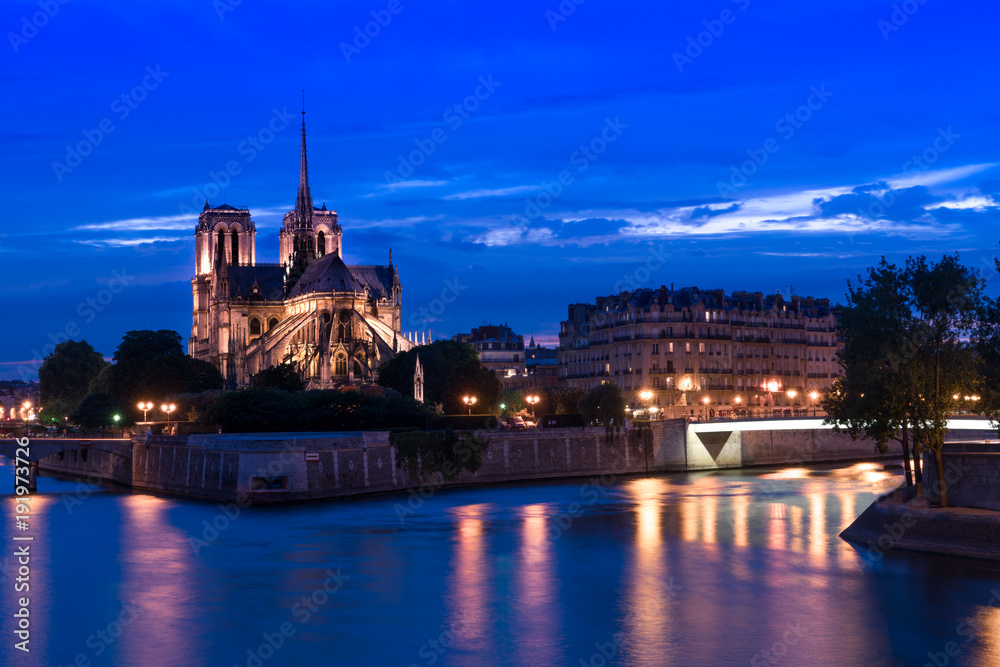 Notre-Dame Cathedral with light & Seine River at night