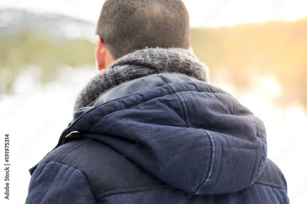Man with hooded back and scarf Man with hooded back and scarf