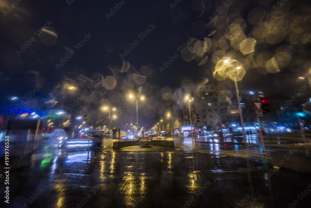 traffic in the city on rainy night 