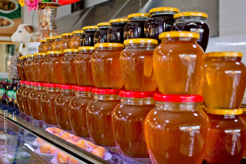 Large assortment of honey in jars