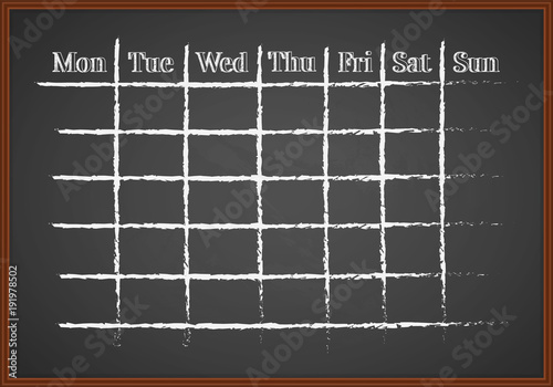 Monthly schedule drawn with chalk on a blackboard