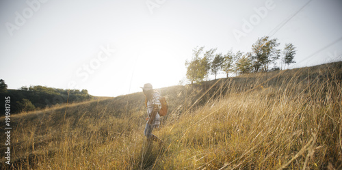 Woman Hiking in Field