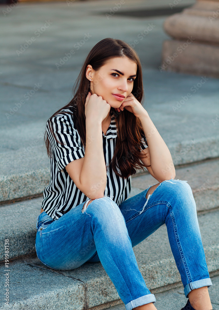 beautiful charming girl, attractive look, girl in jeans and shirt Stock  Photo | Adobe Stock
