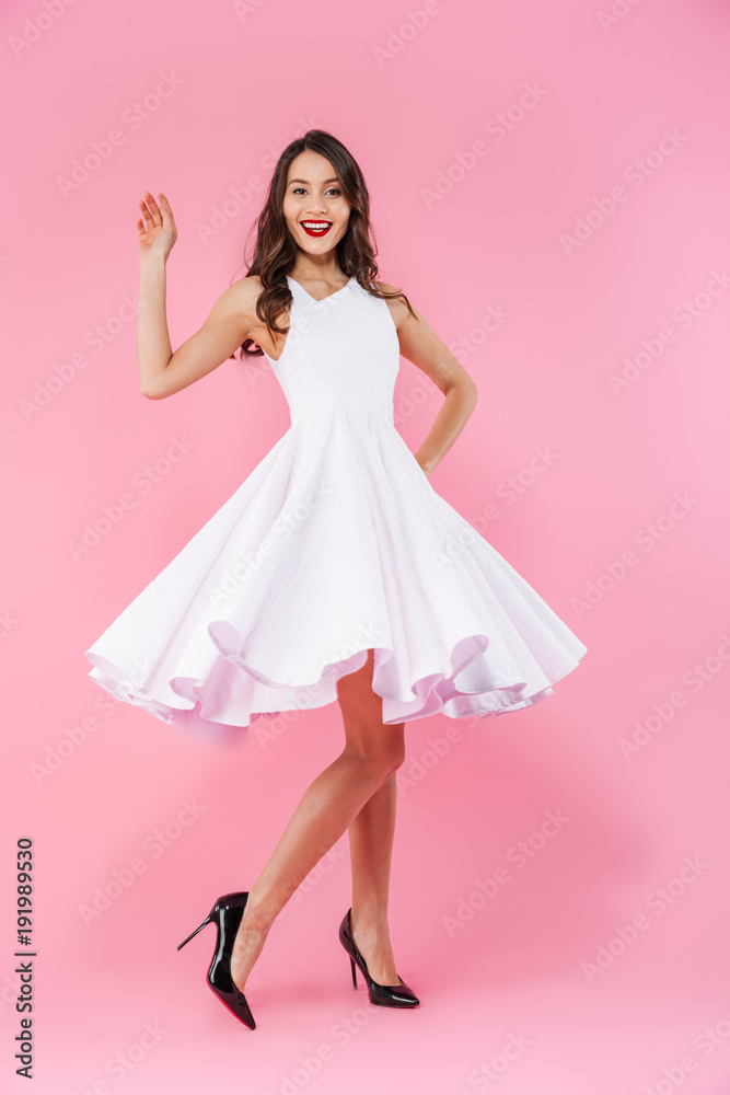 Full length portrait of a smiling young asian woman Full length portrait of a smiling young asian woman