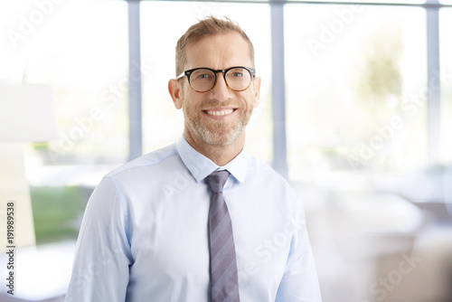 Businessman with toothy smile