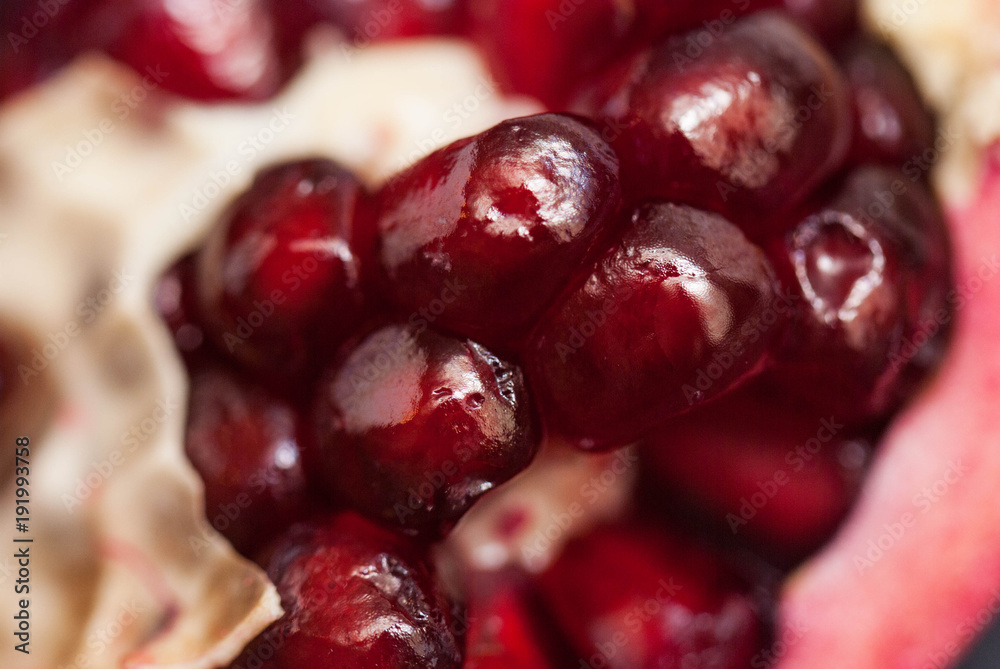 Macro of Fresh Peeled Ripe Seeds Pomegranate Isolated. Red Fruits close Up. Macro of Fresh Peeled Ripe Seeds Pomegranate Isolated. Red Fruits close Up.