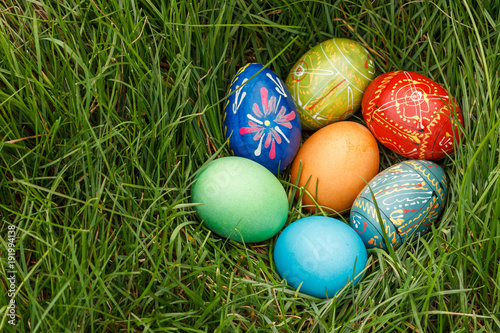 Painted Easter eggs in spring green grass