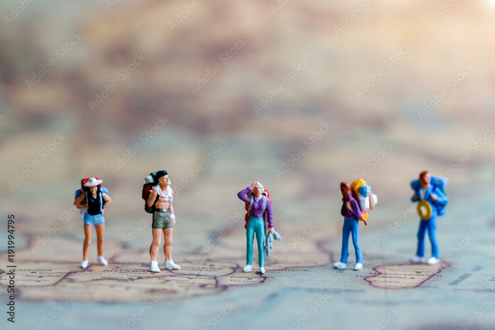 Miniature people: Backpacker on world map, Concept of Travel around the ...