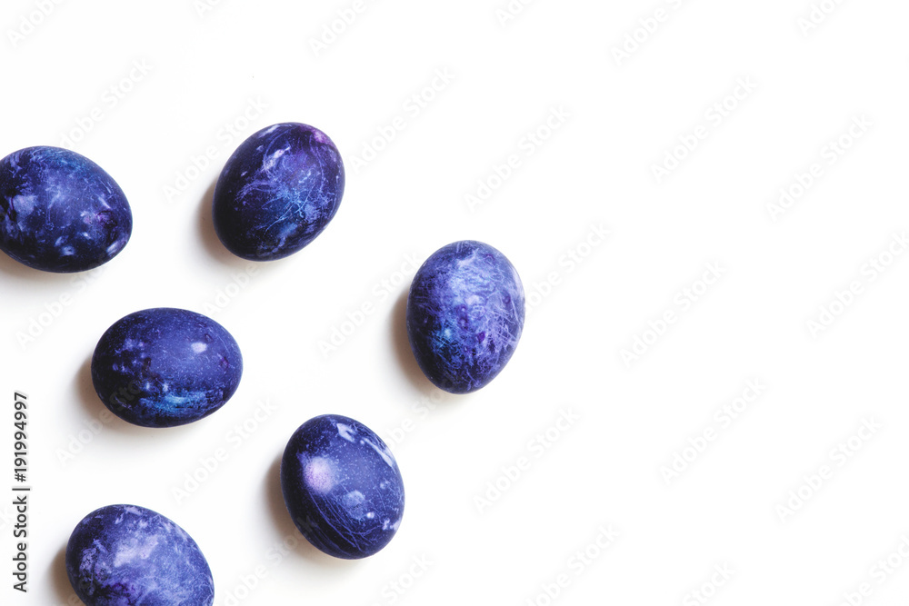 Stylish background of ulta violet Easter eggs isolated on white. Dyed Easter eggs Stylish background of ulta violet Easter eggs isolated on white. Dyed Easter eggs