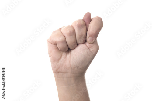 Thumb of right hand between index and middle finger - human hand gesture isolated on white background with copyspace