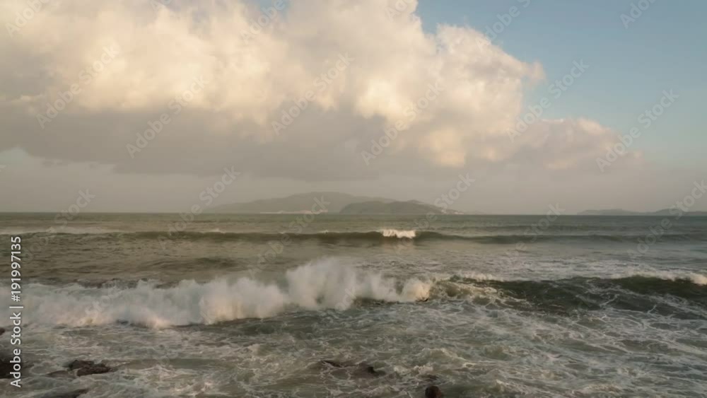 Nha Trang Vietnam looking out over the south China sea with large waves hitting the coastline.