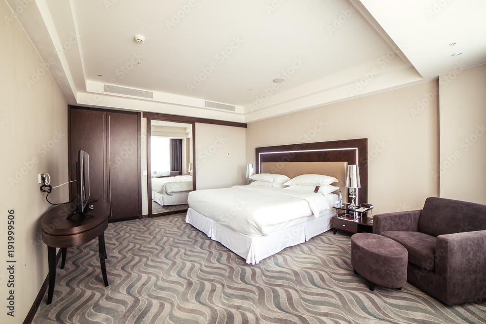 photo of interior design of luxury hotel bedroom