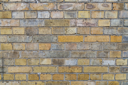 brick wall background in yellow colors