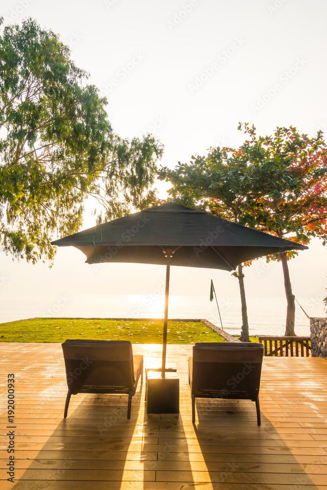 Umbrella and chair neary beach and sea