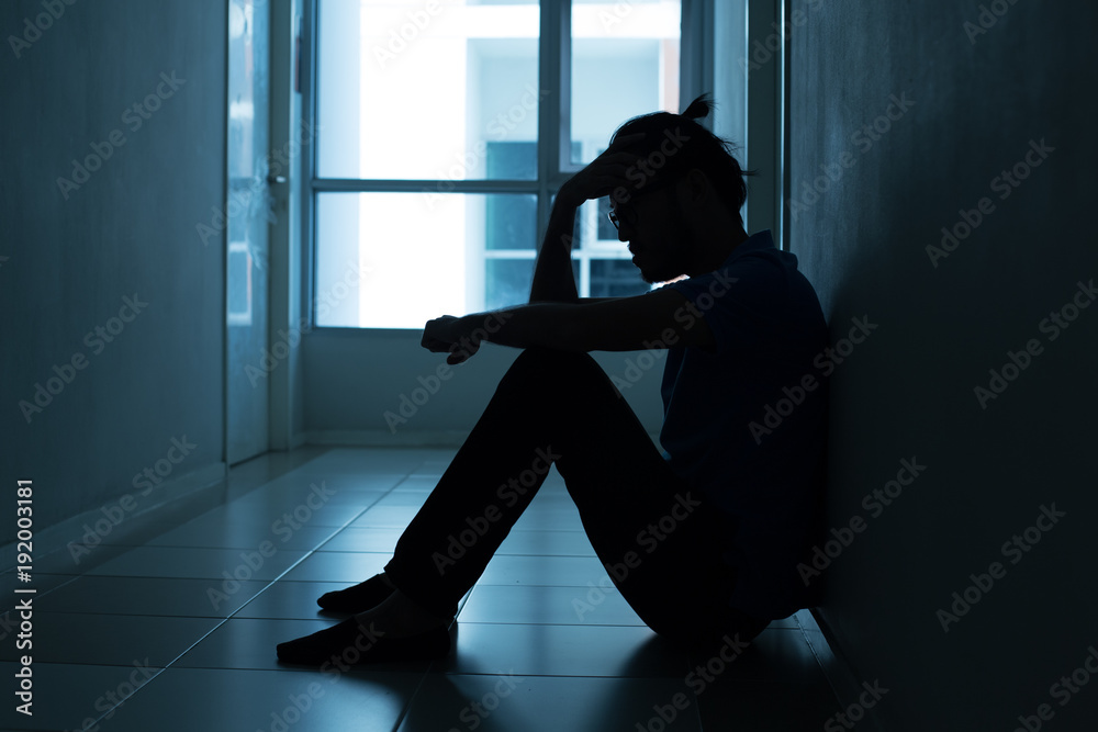 Portrait of man with sad mood. People with sadness concept, with blue tone.