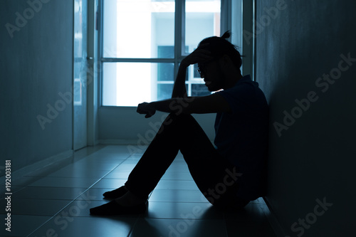 Portrait of man with sad mood. People with sadness concept, with blue tone.