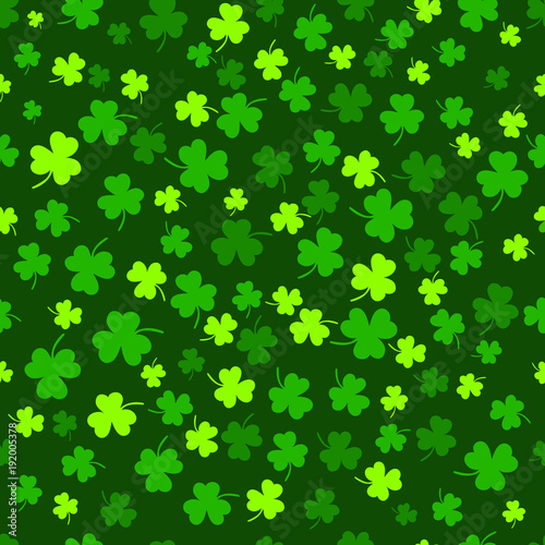 Seamless clover leaf flat design green pattern falling on dark green background vector illustration