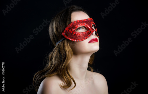 Sexy woman with red mask. 50 shades of grey.