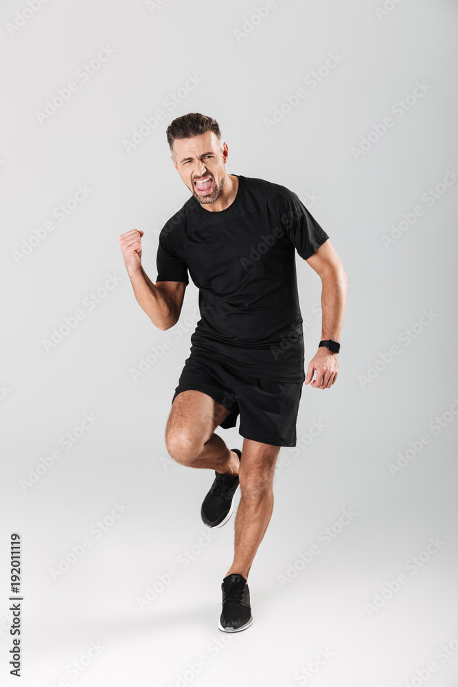 Fototapeta premium Full length portrait of a happy mature sportsman