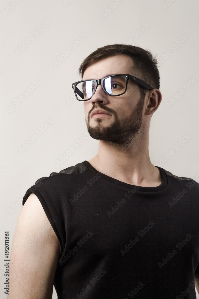 closeup. confident modern man looking over his glasses closeup. confident modern man looking over his glasses